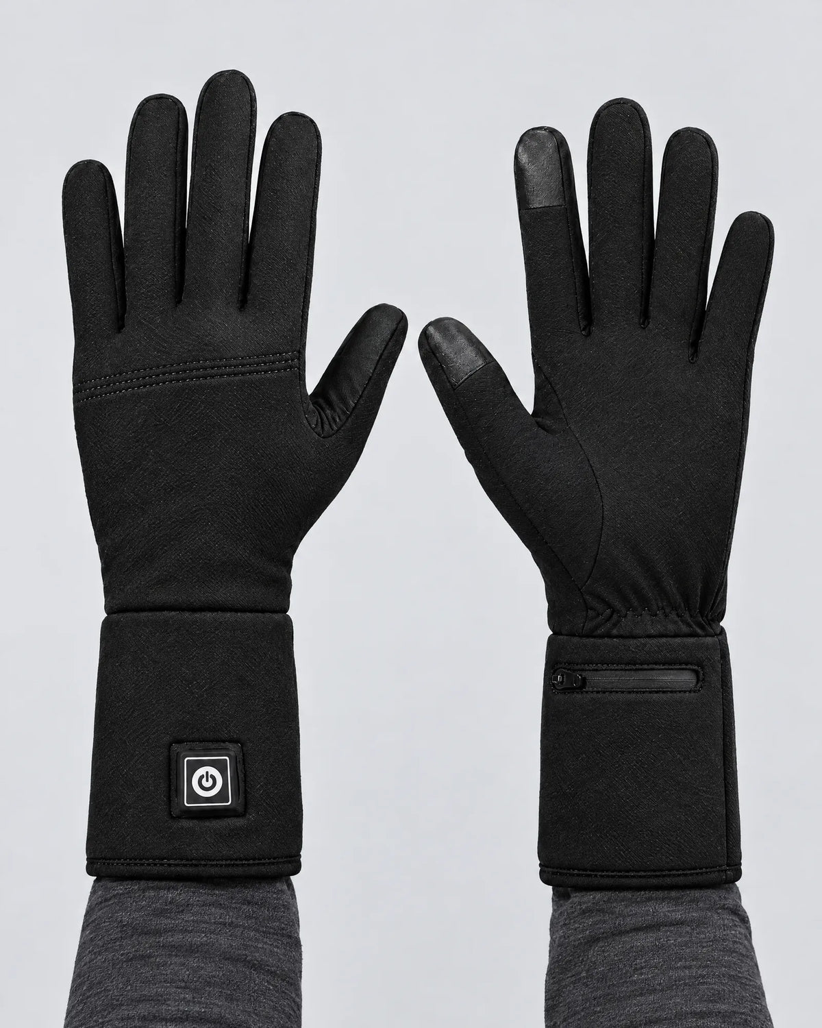 Hands wearing the Belay heated gloves, palm and back views