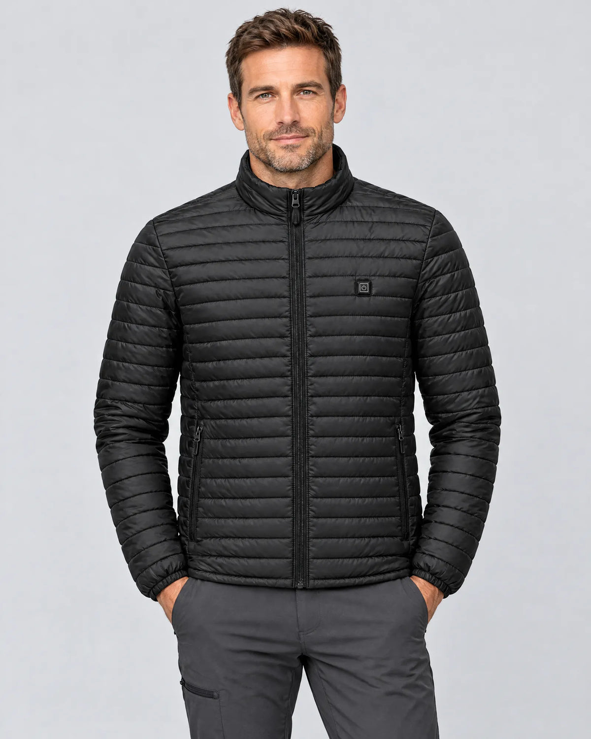 Model wearing the Basecamp men's heated jacket, front view